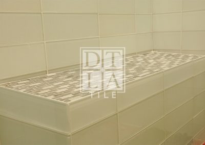 Bathroom glass tile bench in Malibu shower