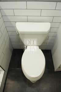 Compton toilet wall in subway tile