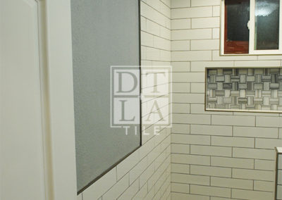 Installation of tile on a floor & wall in Compton bathroom