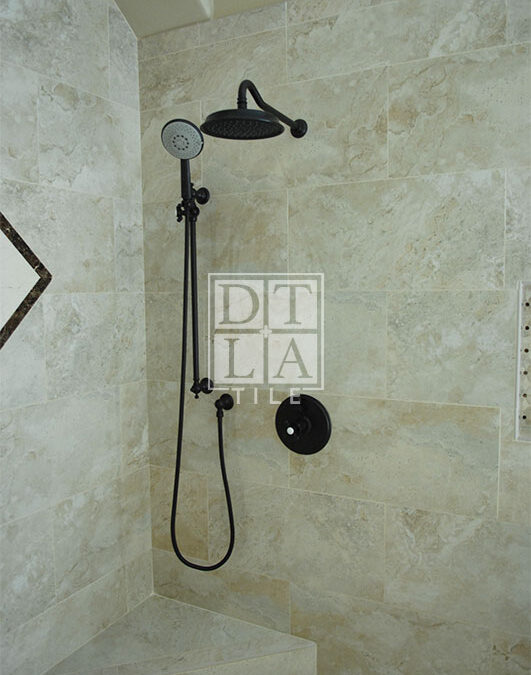 Bench and plumbing view in Manhattan Beach bathroom remodel installation of porcelain tile