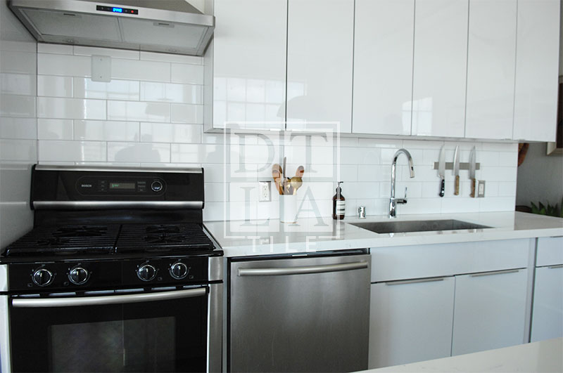 Kitchen with a tile backsplash in Fashion District of Downtown Los Angeles