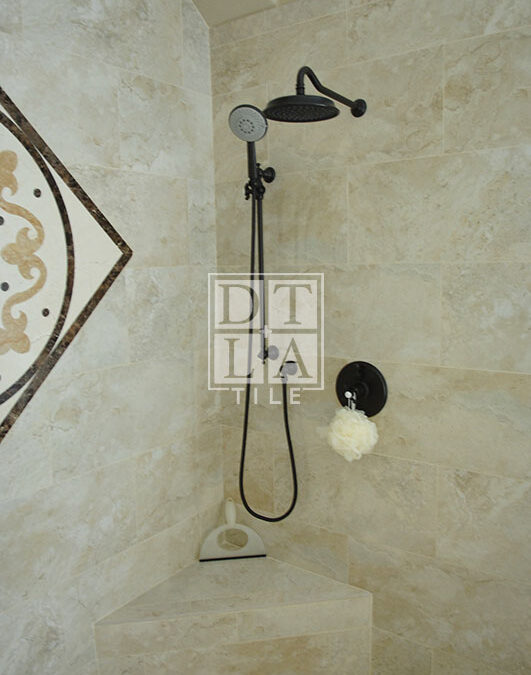 Shower enclosure and new plumbing fixtures of bathroom with porcelain tile in Manhattan Beach