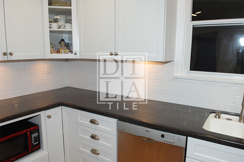 Subway Tile installation in Kitchen with white grout