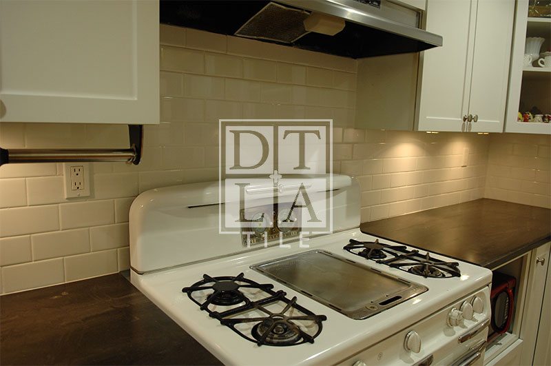 Tile installation with subway tile with kitchen sink