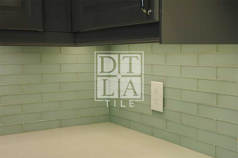 Different view of kitchen backsplash with glass tiles