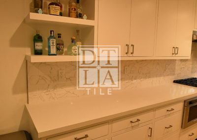 Kitchen tile installation in Santa Monica using Carrara White Subway Tile with Schluter Trim